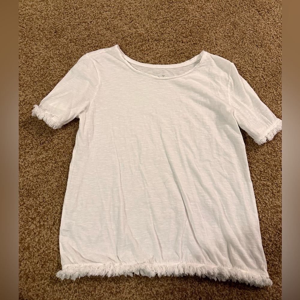 2 white tees, one with ruffles